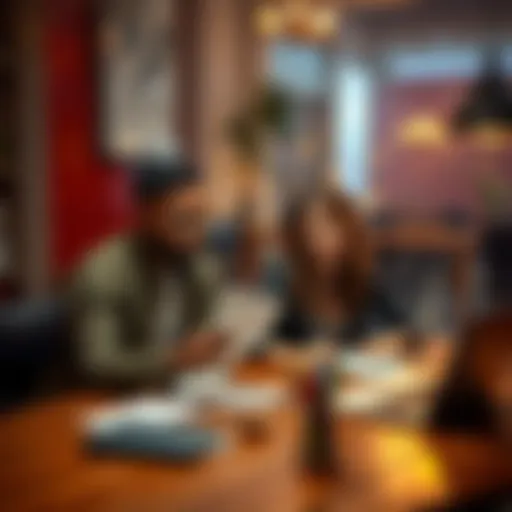 Andre and Kayla sit at a table with papers and a laptop, looking concerned about Colom currency issues.