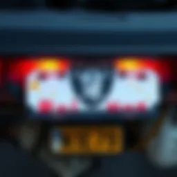 A colorful bumper sticker featuring playful raider imagery, mounted on a car's rear bumper, showcasing joy and humor