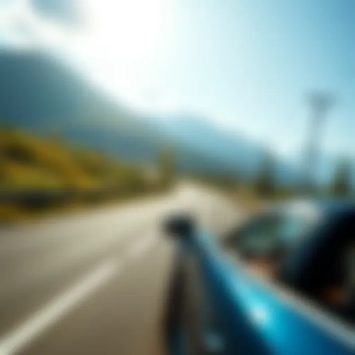 A car driving along a scenic road with mountains and greenery on a sunny day, symbolizing summer adventures and challenges in gaming rewards.