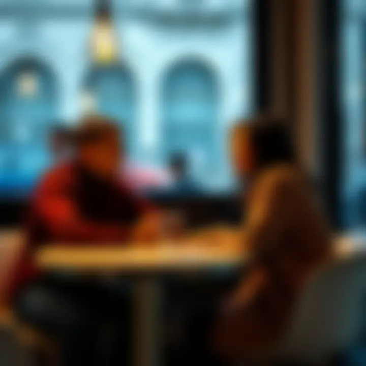A couple sitting together at a table, smiling and talking to each other, showing mutual understanding and connection.