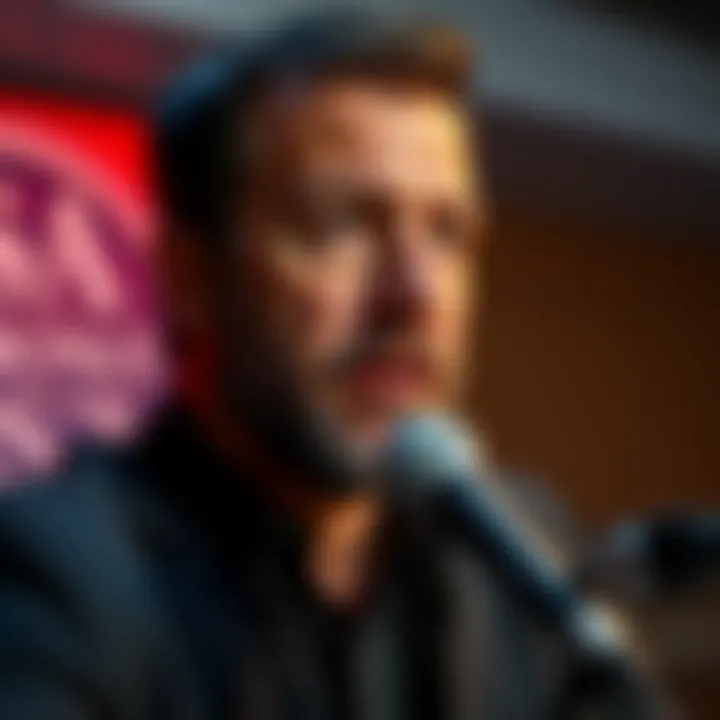 Dan Saltman speaking about his admission of using misused clips against Hasan, in front of a microphone