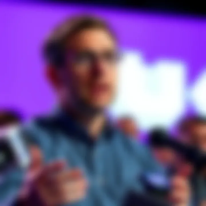 Dan Clancy, CEO of Twitch, discusses the future of Ice Poseidon's ban during a press conference, with a Twitch logo in the background.