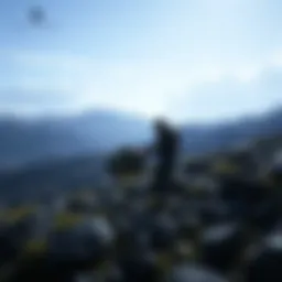 A scene from Death Stranding Director's Cut showing a character carrying cargo across a rugged landscape.