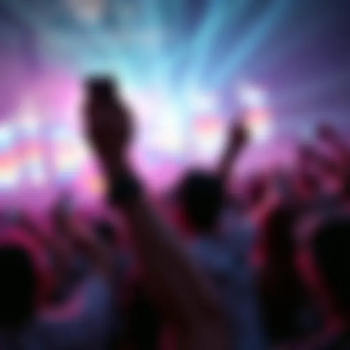 Fan excitedly holding phone after it was thrown by rapper PlaqueBoyMax during Rolling Loud concert