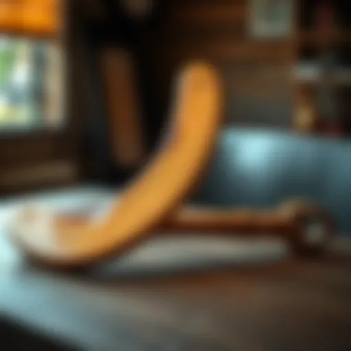 A Kylie boomerang and a native war club displayed together on a wooden table, highlighting their design and features.