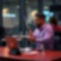 A person sitting at a table with a laptop and notes, expressing their viewpoint passionately during a discussion.