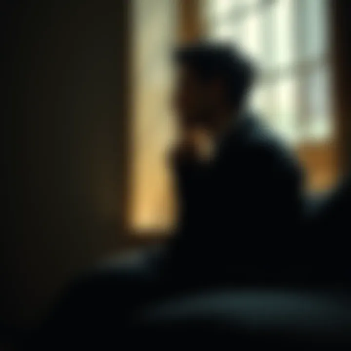 A person sitting alone in a dimly lit room, looking contemplative while gazing out a window, symbolizing inner doubts and uncertainties.
