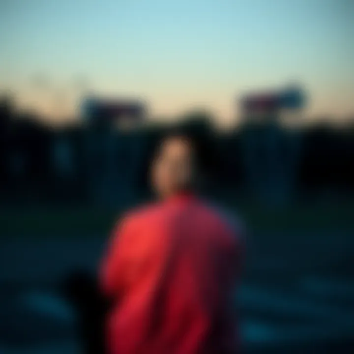 A person reflecting after a loss A person sits alone with a thoughtful expression, contemplating their feelings after a setback, surrounded by nature.