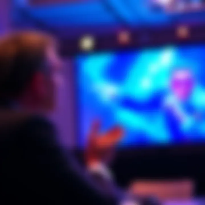 A PlayStation executive speaking at a conference about budget cuts affecting Bluepoint games, with a presentation slide in the background showing game graphics.