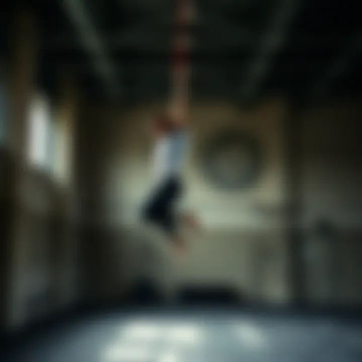 Aerial practitioner executing a wall jump with clear technique in a gym setting
