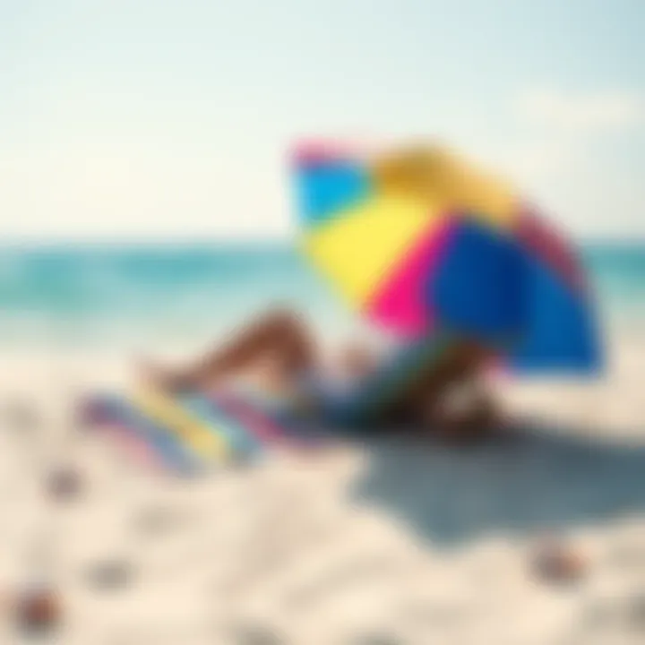 A person lounging on a beach towel under a colorful umbrella, enjoying the sun and sea breeze, with gentle waves in the background.