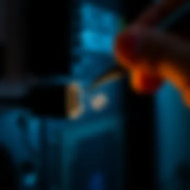 Removing broken HDMI cord Person carefully extracting a broken HDMI cord from a PC port using tweezers