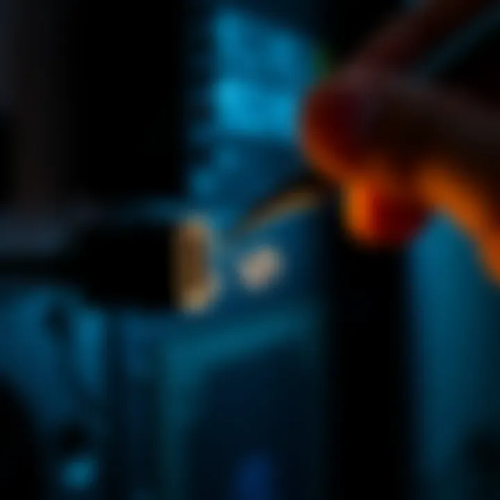 Removing broken HDMI cord Person carefully extracting a broken HDMI cord from a PC port using tweezers