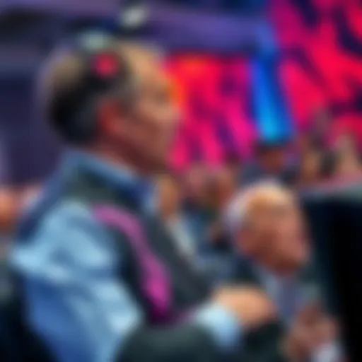 A Take-Two executive speaking at a gaming conference, highlighting the importance of PC gaming with excited fans in the background.