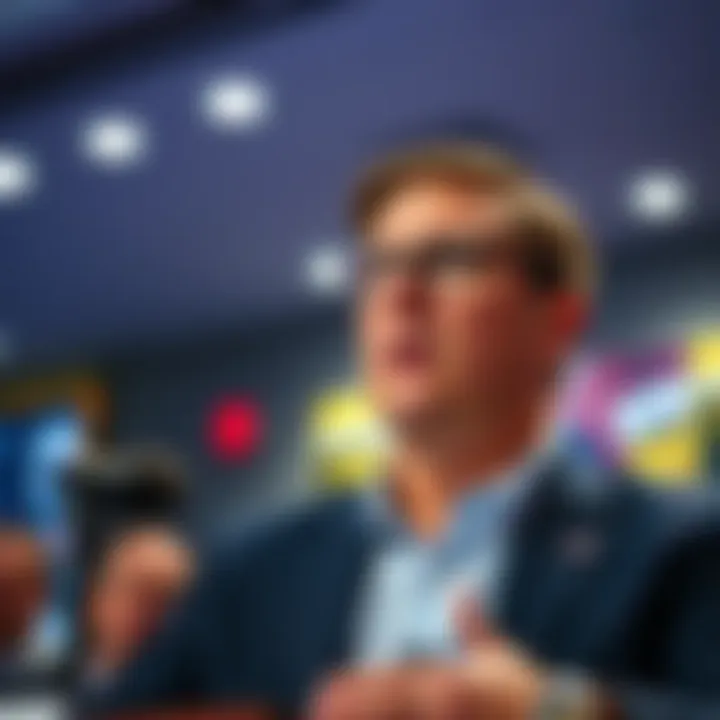 Tim Sweeney speaking at a conference, looking serious as he addresses criticism from the public.