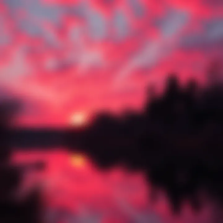 A stunning red sunset over a calm lake, reflecting the hues in the water and trees nearby.
