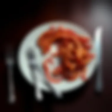 Worms on a dinner plate A plate with a colony of worms arranged as if for a dinner date, with a fork and knife beside it.