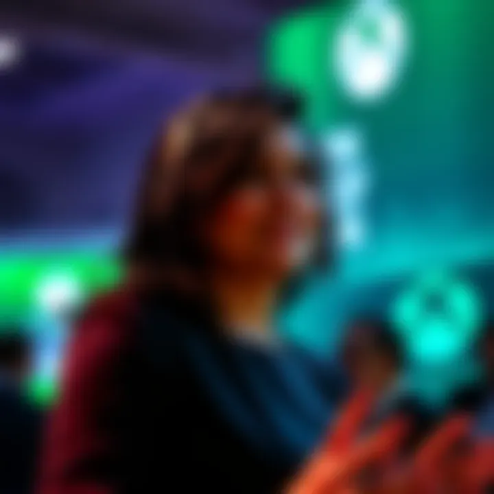 Asha Sharma speaking at a gaming event about Xbox exclusives and audience reach