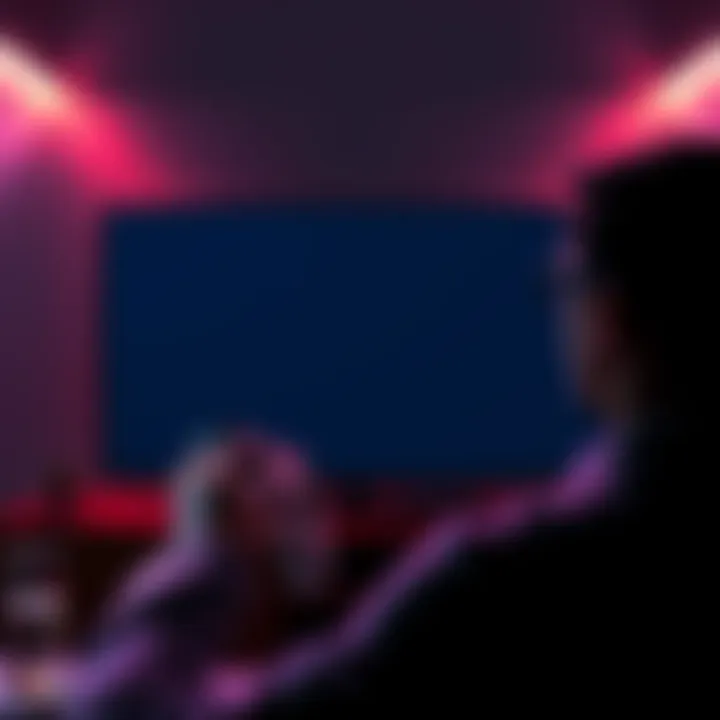 A person looking at a TV displaying a black screen while trying to fix Xbox One issues